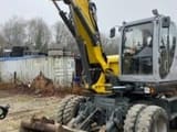 2020 Wacker Neuson EW100 wheel excavator, front three-quarter view