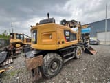 2018 Caterpillar M315F wheel excavator, rear three-quarter view