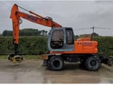 2002 New Holland EX165W wheel excavator, side profile view