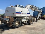 2008 New Holland MH-PLUS wheel excavator, rear three-quarter view