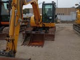 2023 Komatsu PC80MR-5 crawler excavator, front three-quarter view