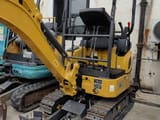 2026 XCMG XE17U Mini Excavator with its yellow boom and dozer blade extended forward.