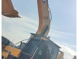 2023 Caterpillar 315D2 crawler excavator, side view of cab and boom