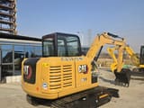 2024 Caterpillar 305.5 mini excavator, rear three-quarter view