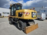 2014 Caterpillar M315D wheel excavator, rear three-quarter view