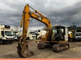 2005 Caterpillar 311C crawler excavator, side view