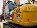 2025 Caterpillar 320D2 crawler excavator rear three-quarter view
