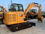 2023 Caterpillar 306E2 mini excavator, rear three-quarter view