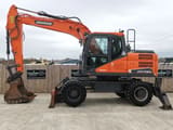 Doosan DX140W wheel excavator, side profile view
