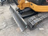 2025 Caterpillar 303 mini excavator front blade and tracks view