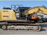 2012 Caterpillar 320E crawler excavator, side profile view