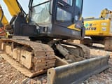 2023 Hyundai R60-7 mini excavator, side view of undercarriage and blade