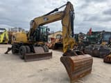2010 Caterpillar M313D wheel excavator, front three-quarter view