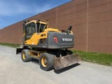 2013 Volvo EW140D wheel excavator, rear three-quarter view