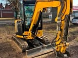 2023 Caterpillar 302.7CR mini excavator, front three-quarter view