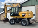 2011 Caterpillar M313D wheel excavator, side view
