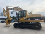 Caterpillar 320CL rupsgraafmachine uit 2015, zijaanzicht
