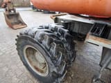 1990 Atlas 1604K wheel excavator dual tire and bucket view