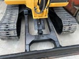 2024 Caterpillar 305.5 mini excavator front blade and tracks view