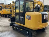 2023 Caterpillar 305.5E2 mini excavator, rear three-quarter view