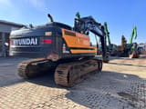 2022 Hyundai HX300ANL crawler excavator, rear three-quarter view
