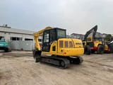 2024 Komatsu PC70-8 mini excavator, rear three-quarter view