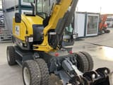 2023 Wacker Neuson EW65 wheel excavator, front three-quarter view