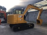 2023 Caterpillar 307E2 crawler excavator, rear three-quarter view