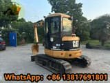 2010 Caterpillar 304 CR mini excavator, rear three-quarter view