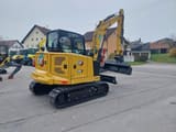Caterpillar 306 CR mini excavator, rear three-quarter view
