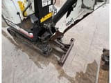 Bobcat E10Z mini excavator, high-angle view of the operator station and boom