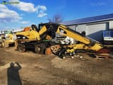 2008 Caterpillar M318D material handler, side view