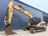 2007 Caterpillar 320DL rupsgraafmachine, zijaanzicht