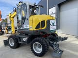 2022 Wacker Neuson EW100 wheel excavator, rear three-quarter view