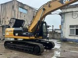 2020 Caterpillar 325BL crawler excavator, side view
