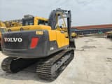 2023 Volvo EC140DL crawler excavator, rear three-quarter view