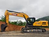 2026 XCMG XE335G Crawler Excavator with its full boom and arm extended forward, showing the digging bucket.