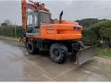 2002 New Holland EX165W wheel excavator, rear three-quarter view