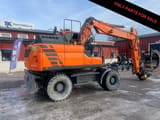 2016 Doosan DX140W-5 wheel excavator side view