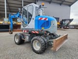 2017 Wacker Neuson EW100 wheel excavator, rear three-quarter view
