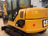 2023 Caterpillar 306D mini excavator, rear three-quarter view