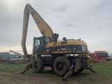 2005 Caterpillar M325C MH material handler, rear three-quarter view
