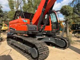 2022 Doosan DX225LC-9C mini excavator, rear three-quarter view