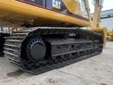 Caterpillar 330BL crawler excavator side view of tracks