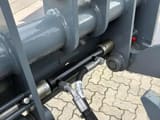 2026 Giant G2500 HD Mini Excavator close-up of hydraulic lines and pins on the gray loader arm