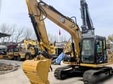 2022 Caterpillar 313D2 GC crawler excavator, front three-quarter view