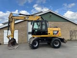 2011 Caterpillar M313D wheel excavator, side profile view