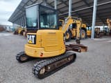 2012 Caterpillar 304E mini excavator, rear three-quarter view