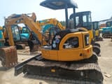 2023 Caterpillar 304CCR mini excavator, rear three-quarter view