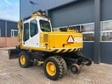 2000 Atlas 1404K wheel excavator, rear three-quarter view